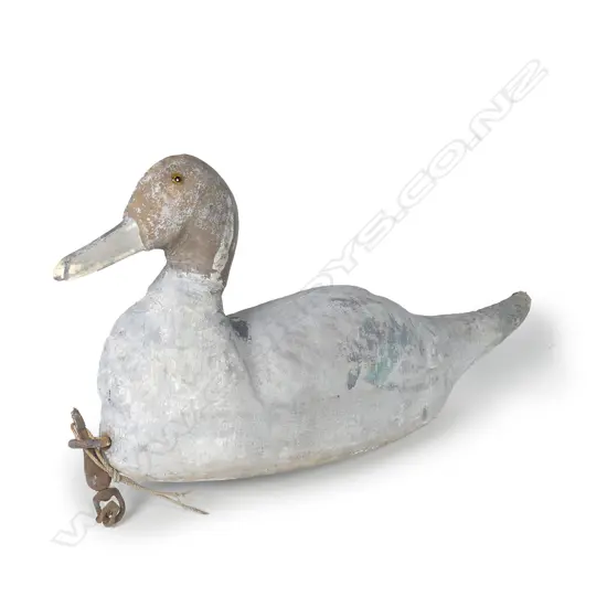 An uncommon 15" c.1900 wood and canvas pintail decoy filled and shaped with cork chips