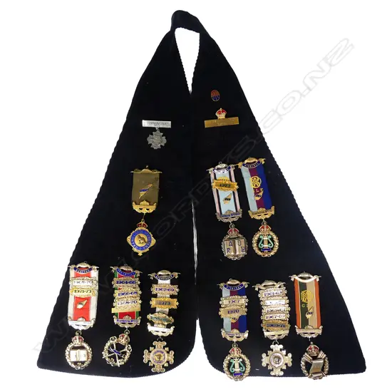 A shawl collar hung with silver RAOB lodge jewels and others