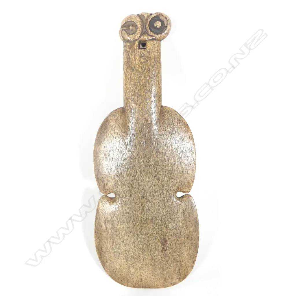 A quality 19thC Maori carved whalebone kotiate (hand club) Image 1++