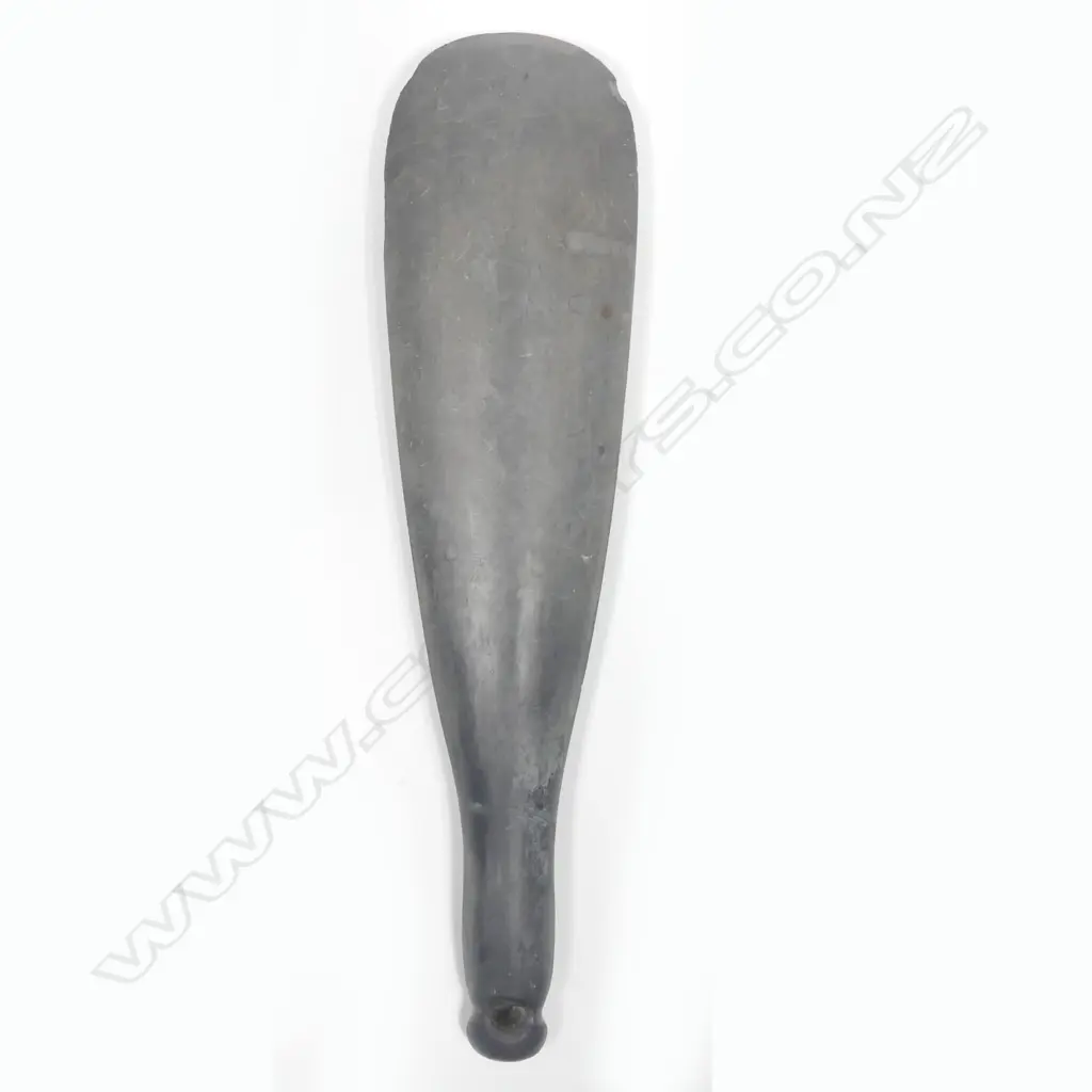 A stone hand club with modified grip Image 1++