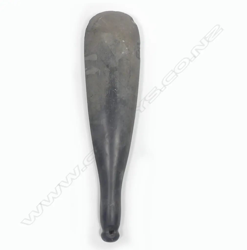 A stone hand club with modified grip Image 1++