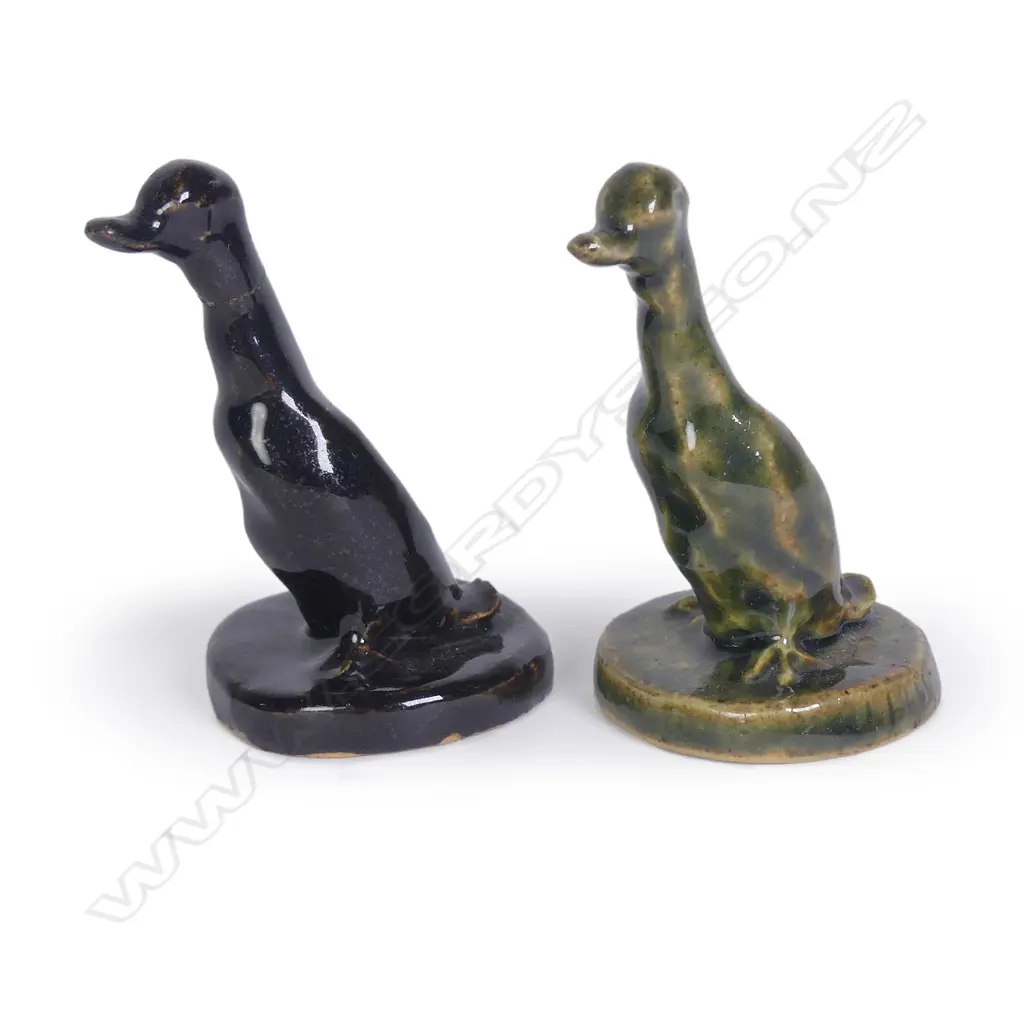 Two Jack Hutchison pottery sculpted ducks; one with green glaze and incised signature to the circular base Image 1++
