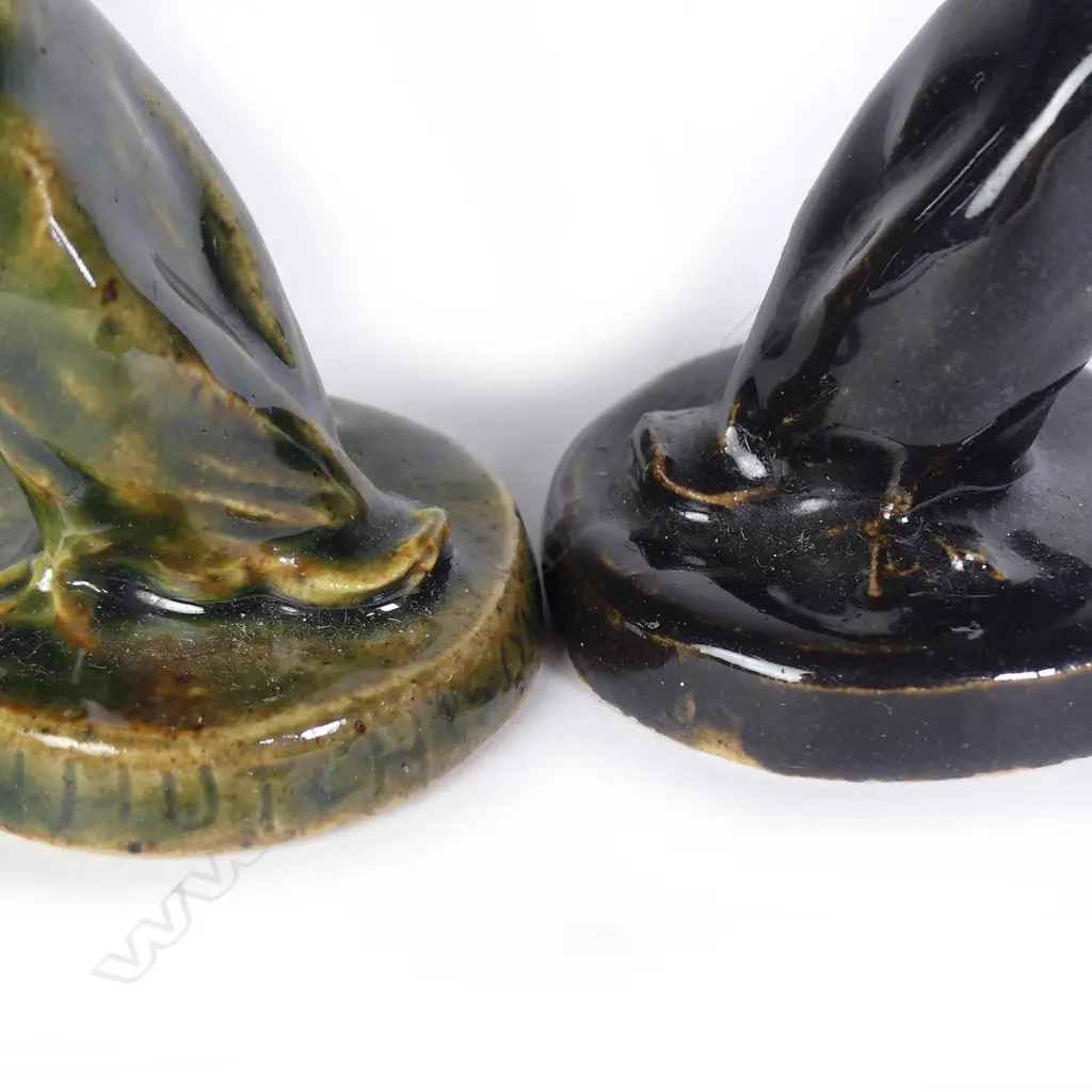 Two Jack Hutchison pottery sculpted ducks; one with green glaze and incised signature to the circular base Image 1++
