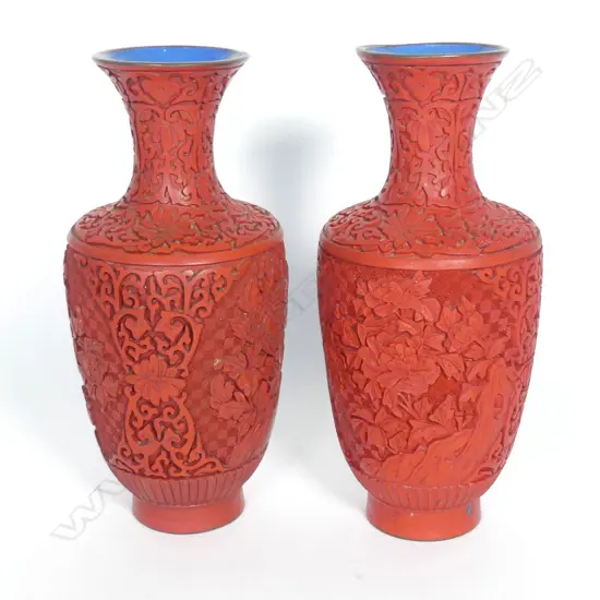 A pair of Chinese cinnabar coloured lacquer vases