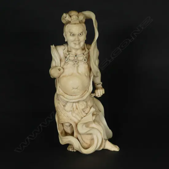 A Japanese ivory okimono of a temple guardian (nio)