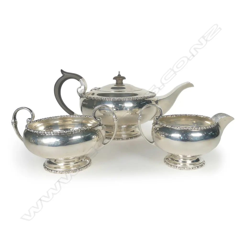 A silver three piece tea set Image 1++