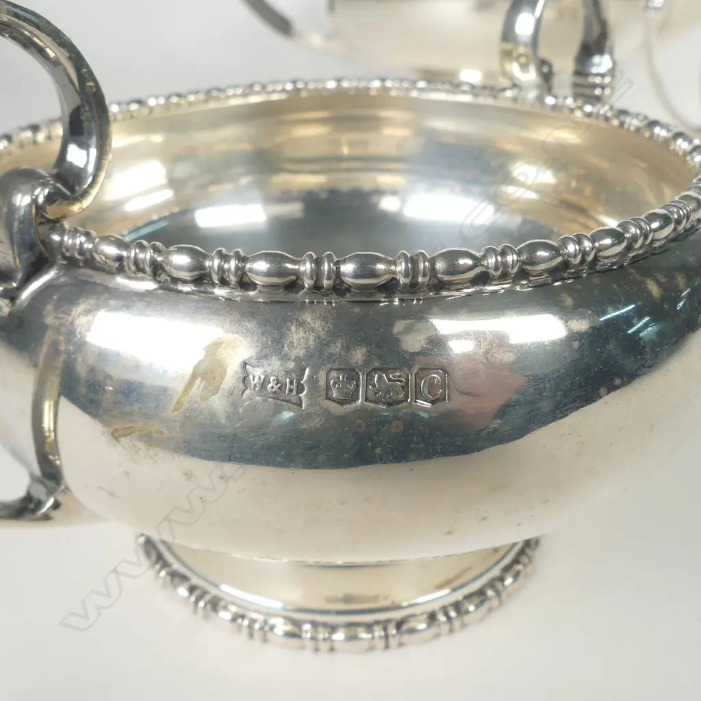 A silver three piece tea set Image 1++