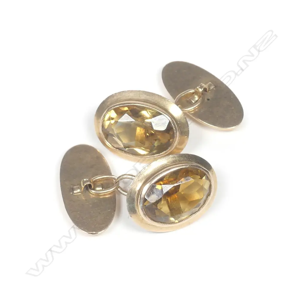 A pair of early 20thC 15ct. yellow gold and citrine cuff links Image 1++