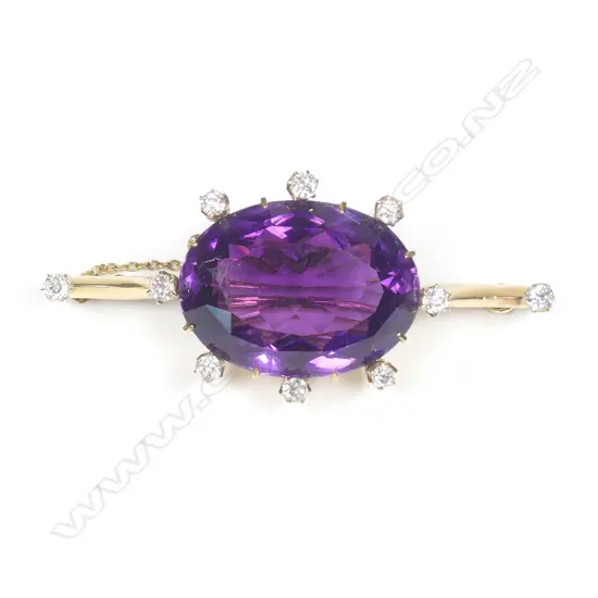 An impressive 18ct gold amethyst and diamond brooch