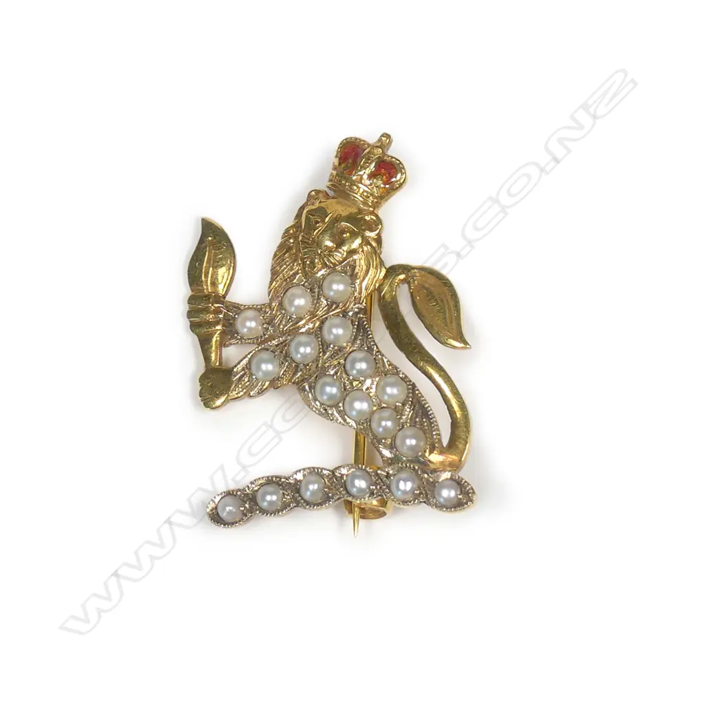 An early 20thC 9ct. yellow gold and seed pearl set lion rampant brooch Image 1++