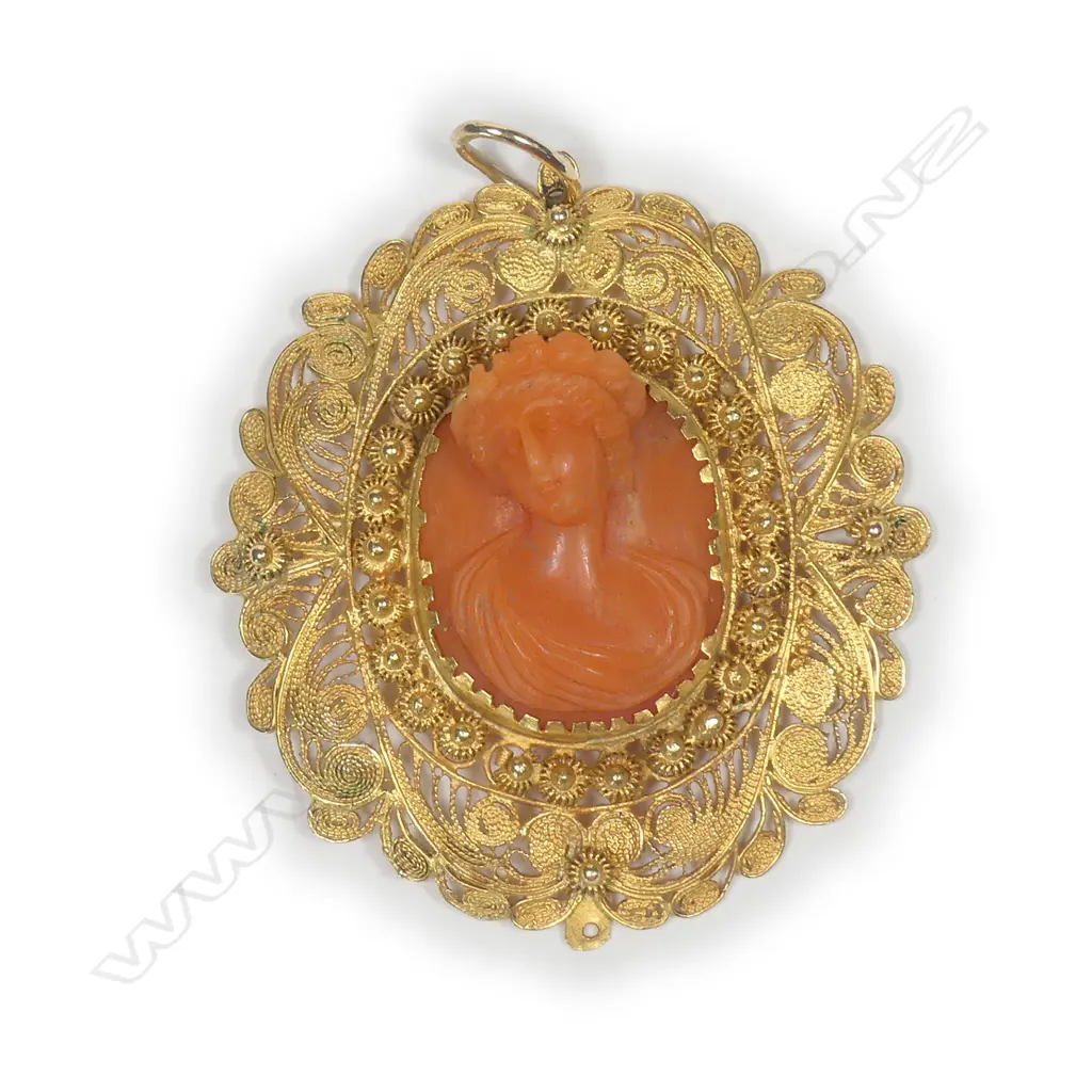 A 19thC Italian 18ct. yellow gold and carved coral portrait bust pendant Image 1++