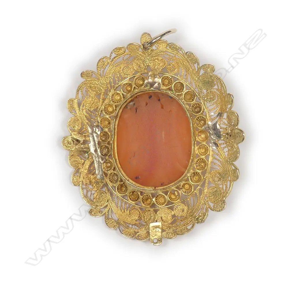 A 19thC Italian 18ct. yellow gold and carved coral portrait bust pendant Image 1++