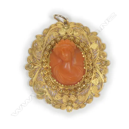 A 19thC Italian 18ct. yellow gold and carved coral portrait bust pendant