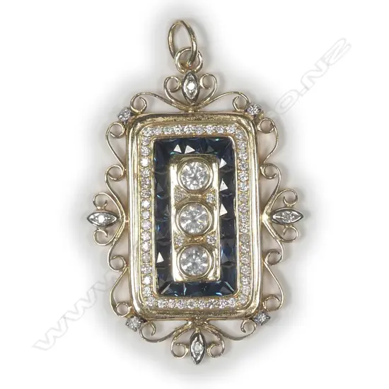 A 14ct yellow gold sapphire and diamond pendant