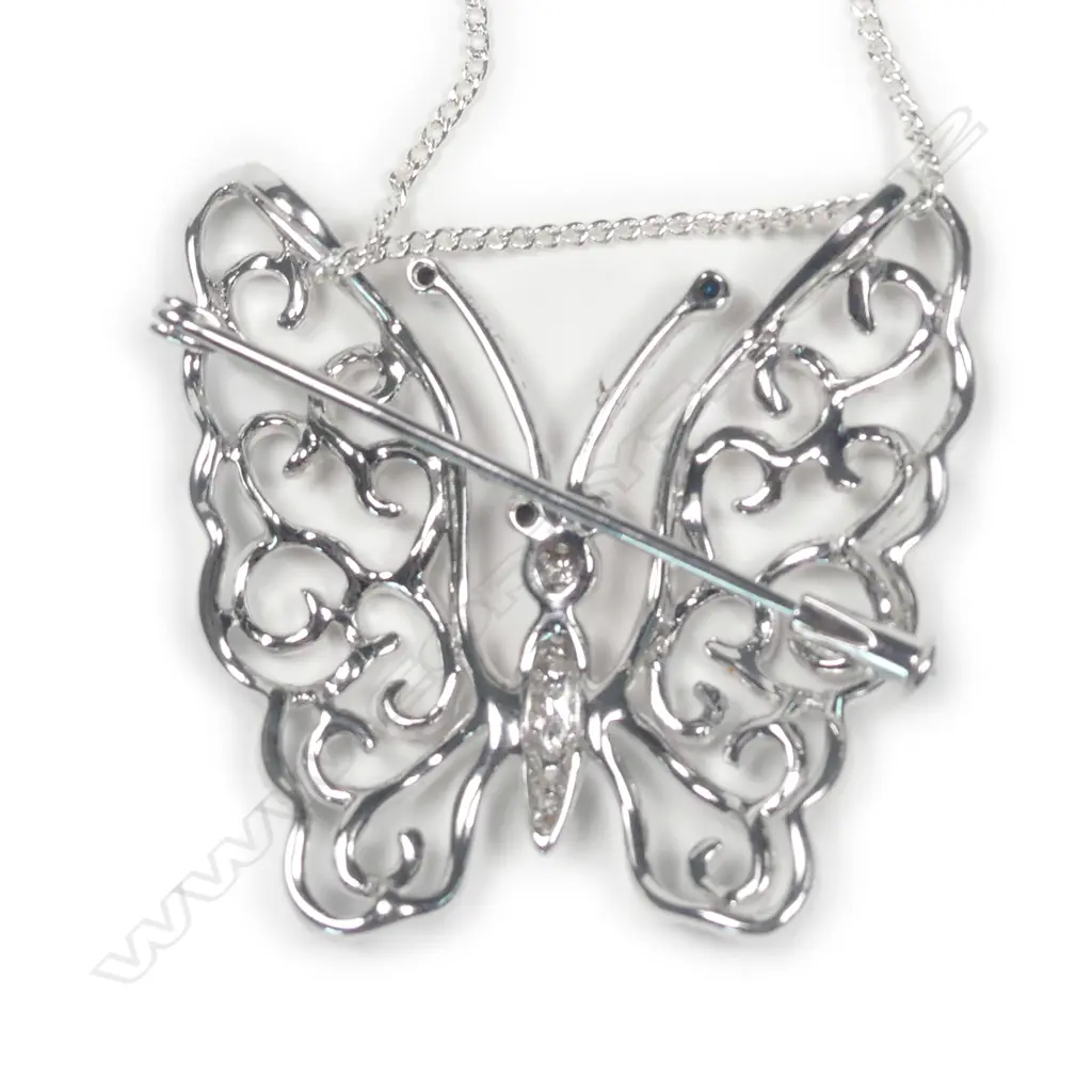 A modern 18ct. white gold and diamond set butterfly pendant/brooch on chain Image 1++