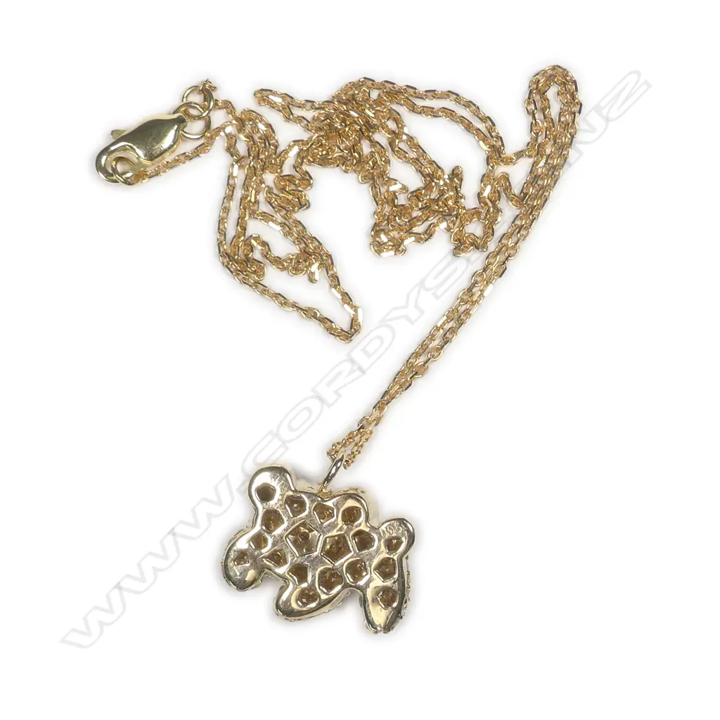 A 9ct. yellow gold and diamond set stylised dog pendant on an 18ct. yellow gold chain Image 1++