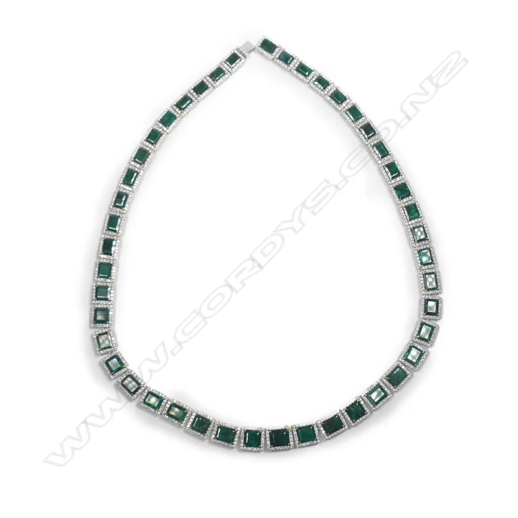 A platinum emerald and diamond halo necklace Image 1++