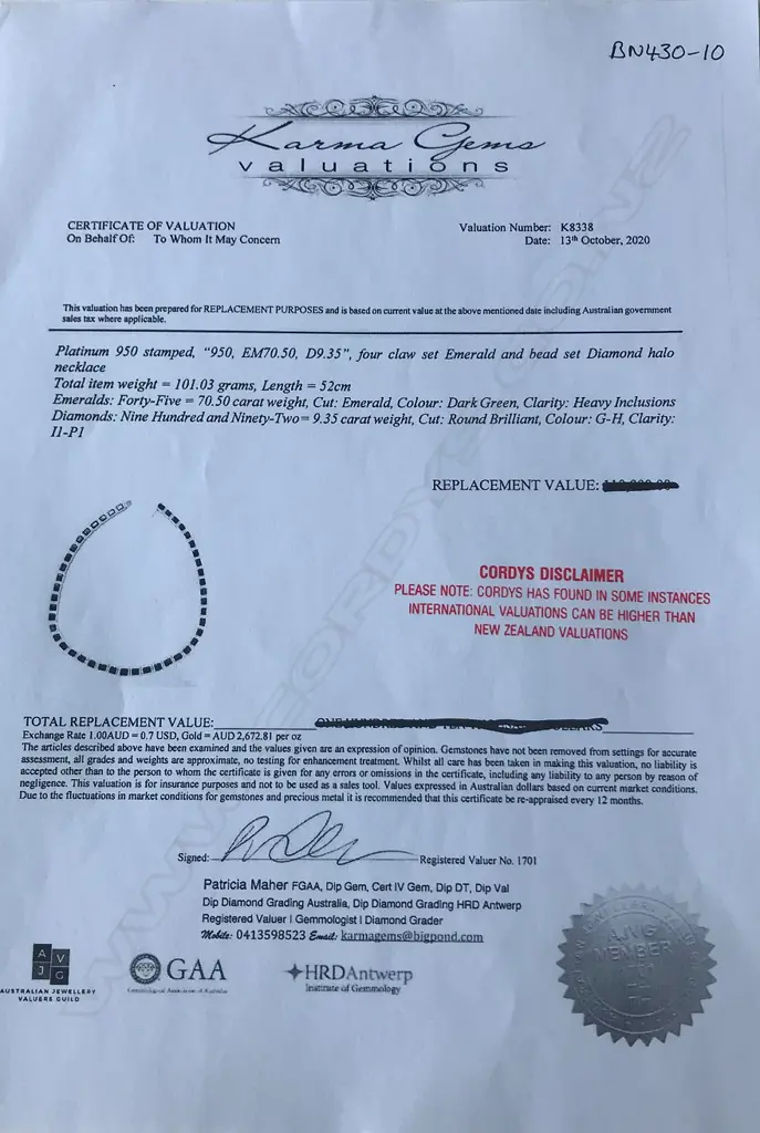 A platinum emerald and diamond halo necklace Image 1++