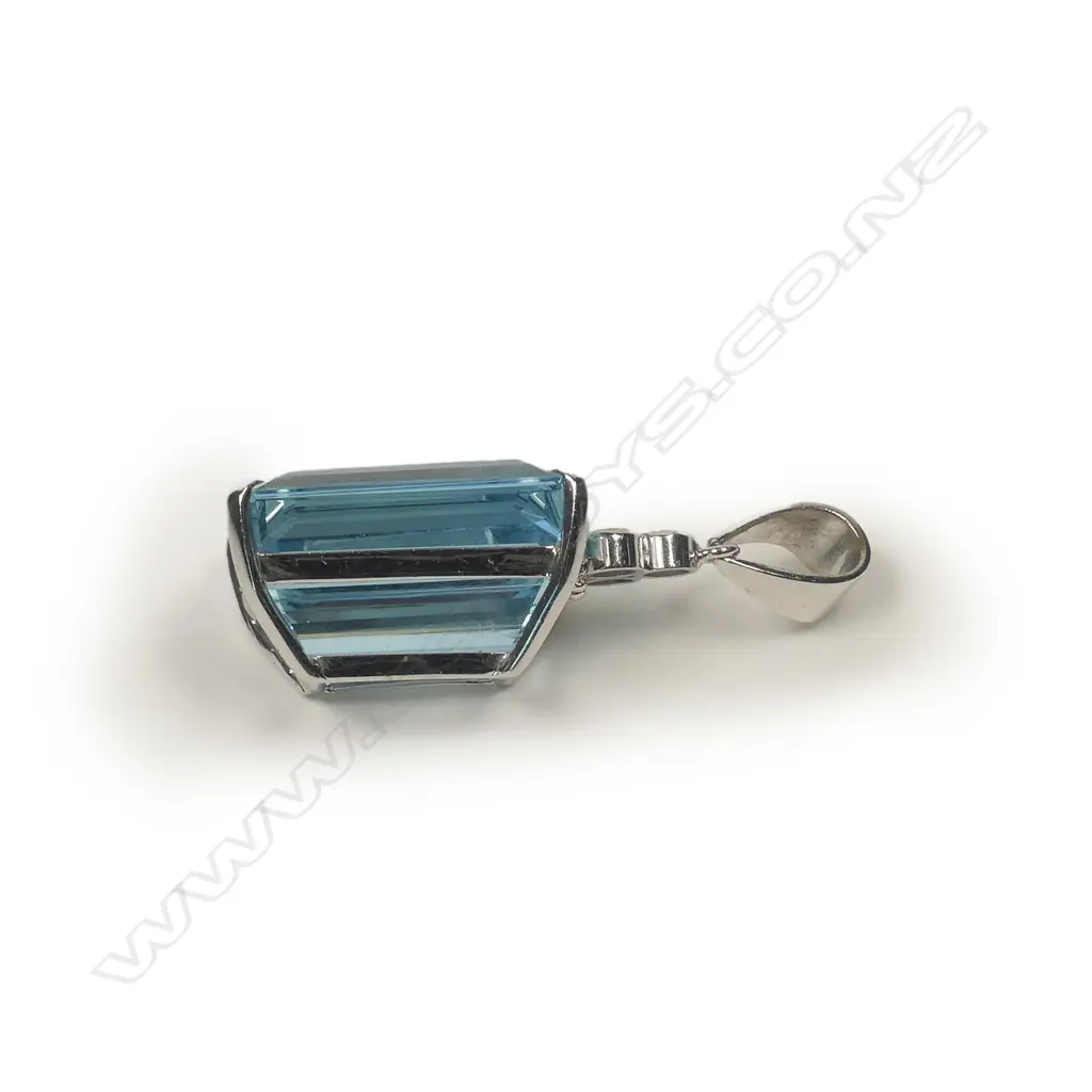 An 18ct white gold aquamarine and diamond pendant Image 1++