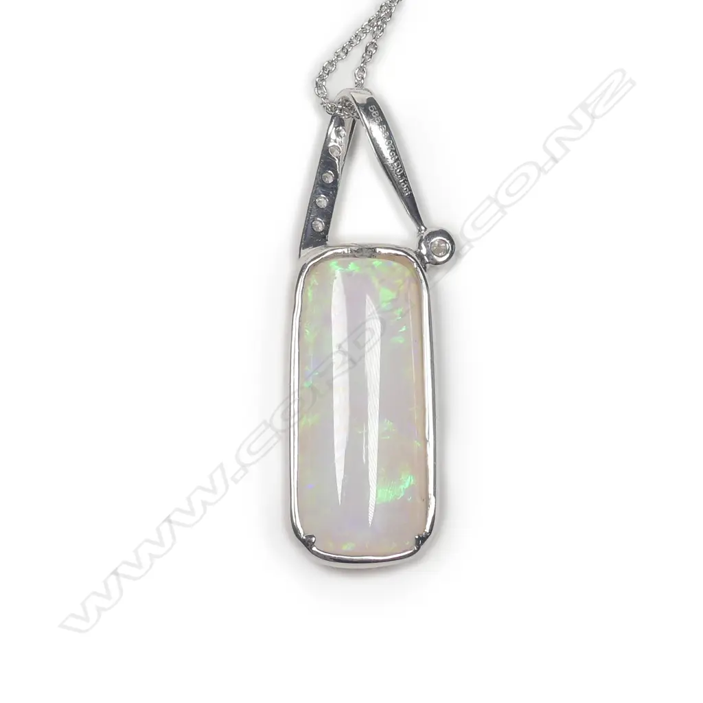 A 14ct white gold Coober Pedy opal and diamond pendant Image 1++