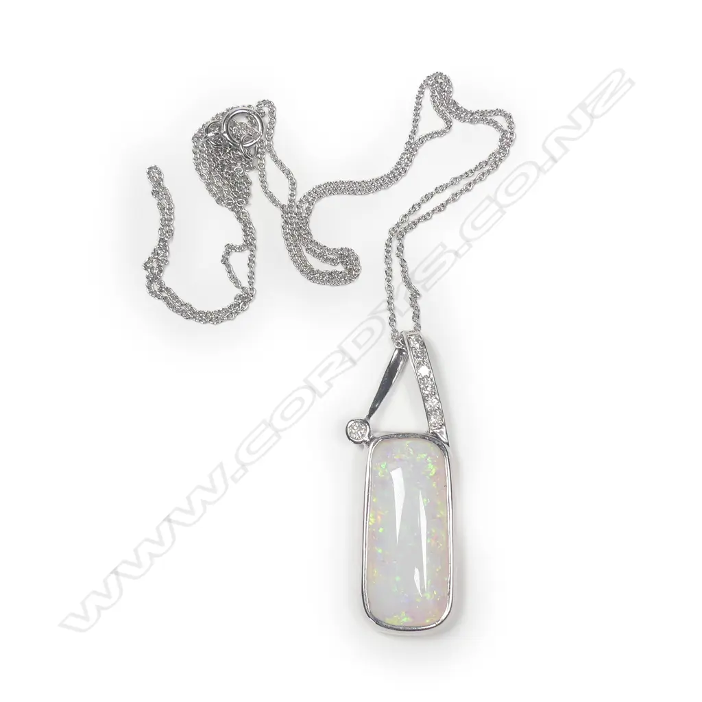 A 14ct white gold Coober Pedy opal and diamond pendant Image 1++