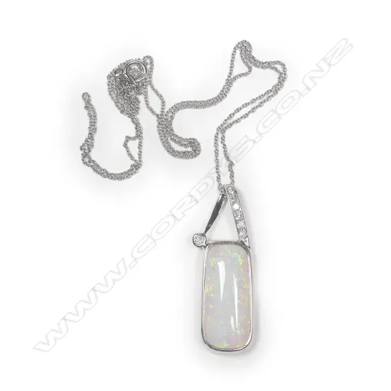 A 14ct white gold Coober Pedy opal and diamond pendant