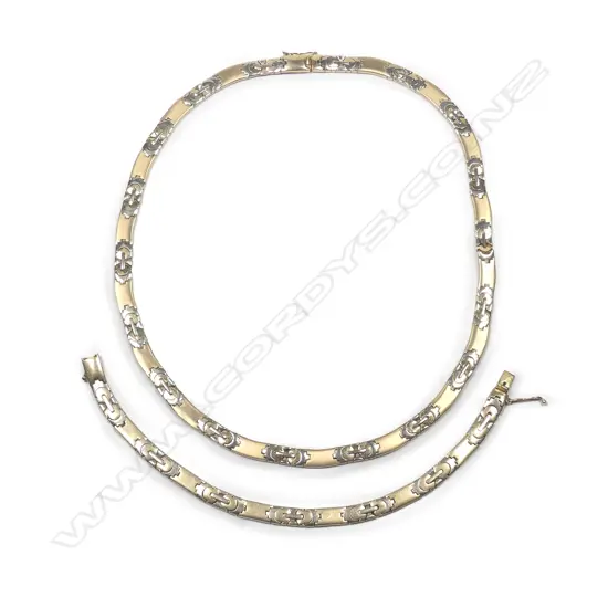 A 14ct yellow and white gold necklace and bracelet set