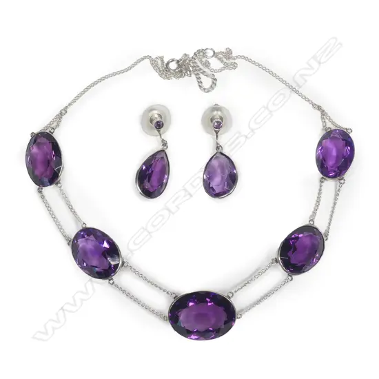 An impressive silver and amethyst necklace and earring set