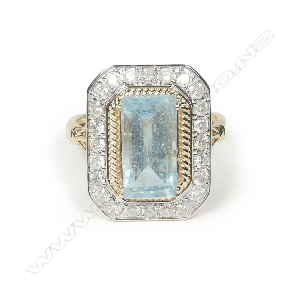 A 14ct gold aquamarine and diamond halo ring Image 1++