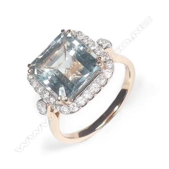 A 14ct rose gold aquamarine and diamond halo ring