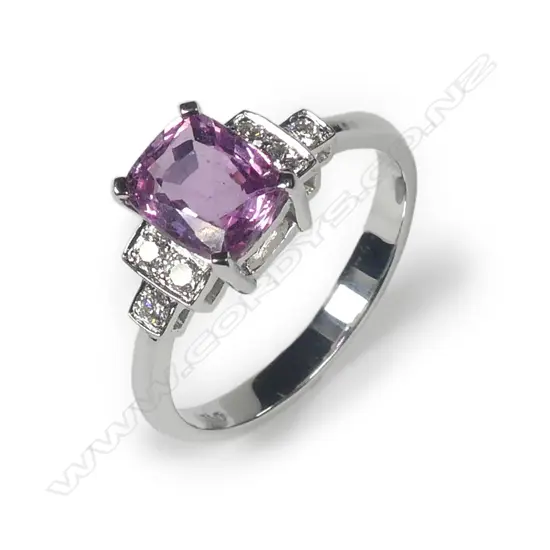 An 18ct white gold pink sapphire and diamond ring