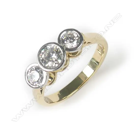 An 18ct gold and three stone diamond ring