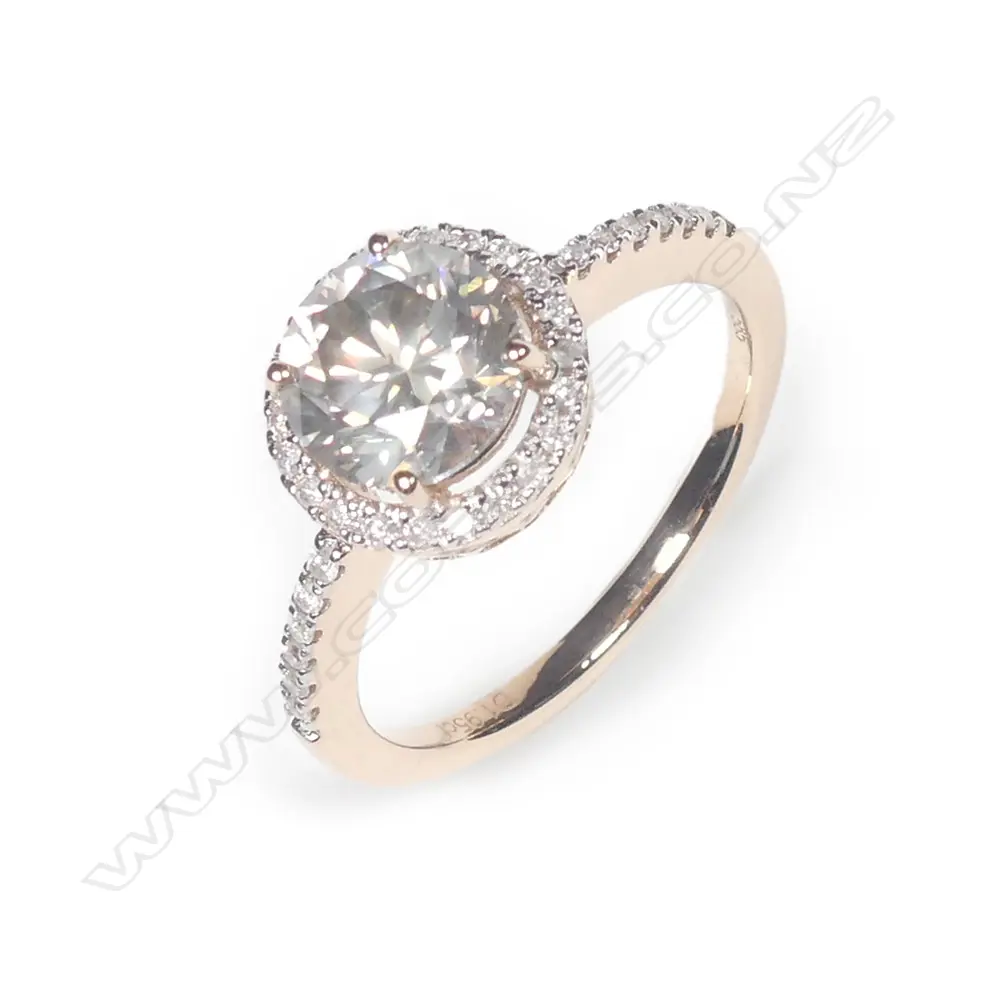 A 14ct rose gold diamond halo ring Image 1++