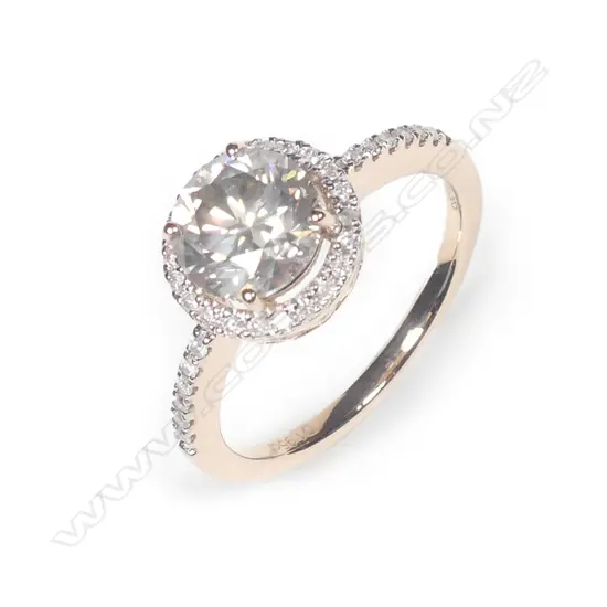 A 14ct rose gold diamond halo ring