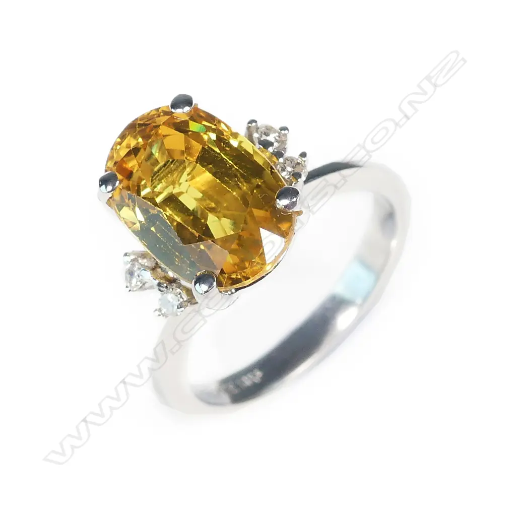 An 18ct white gold and golden sapphire ring Image 1++