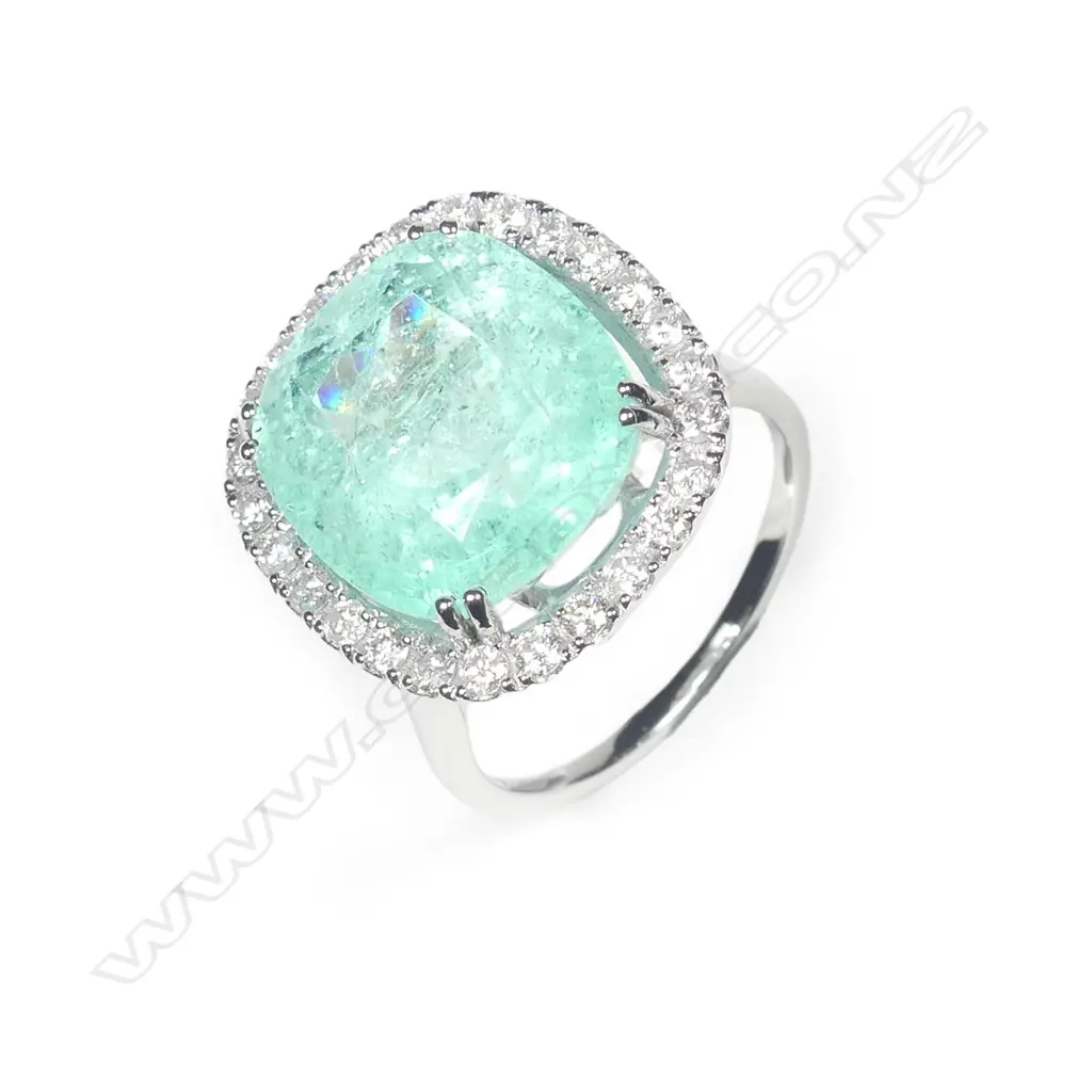 A 14ct white gold Columbian emerald and diamond ring Image 1++