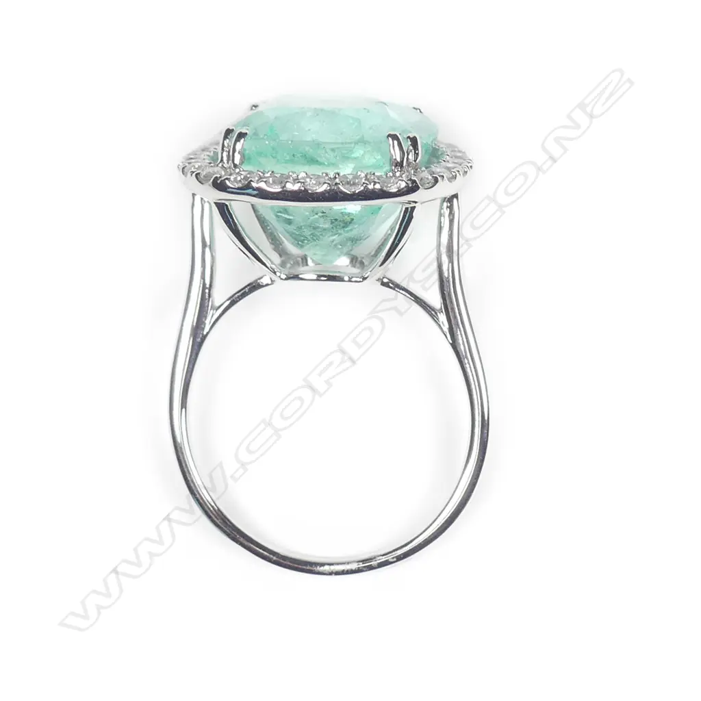 A 14ct white gold Columbian emerald and diamond ring Image 1++