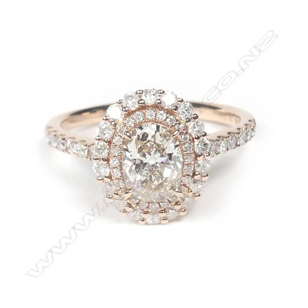 A 14ct rose gold diamond double halo ring Image 1++