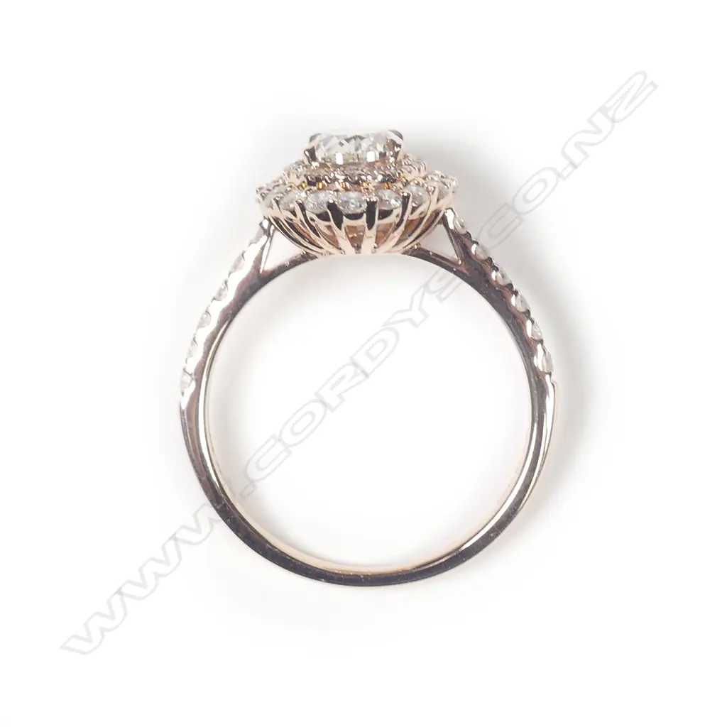 A 14ct rose gold diamond double halo ring Image 1++