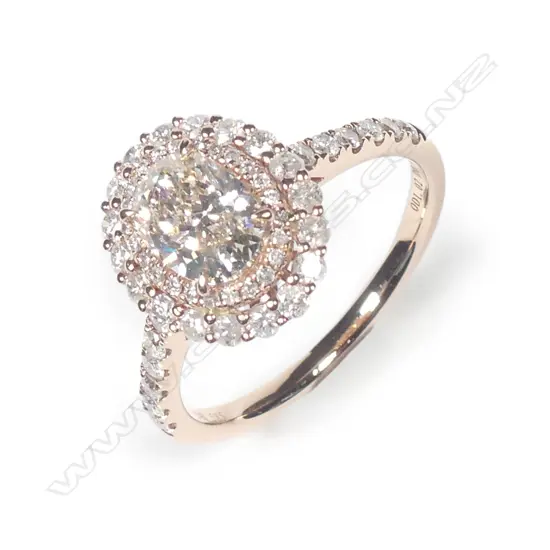 A 14ct rose gold diamond double halo ring