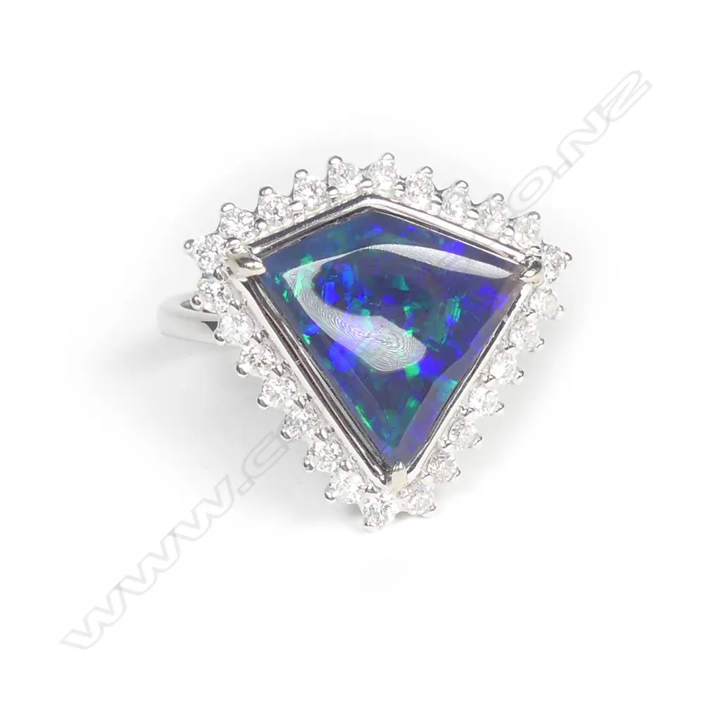 A 14ct white gold opal and diamond ring Image 1++