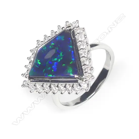 A 14ct white gold opal and diamond ring