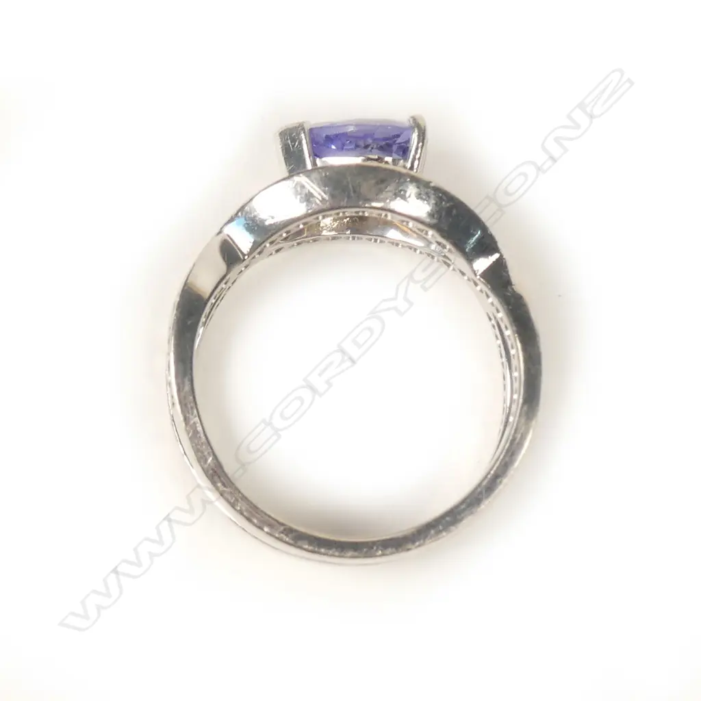 An 18ct white gold tanzanite and diamond ring Image 1++