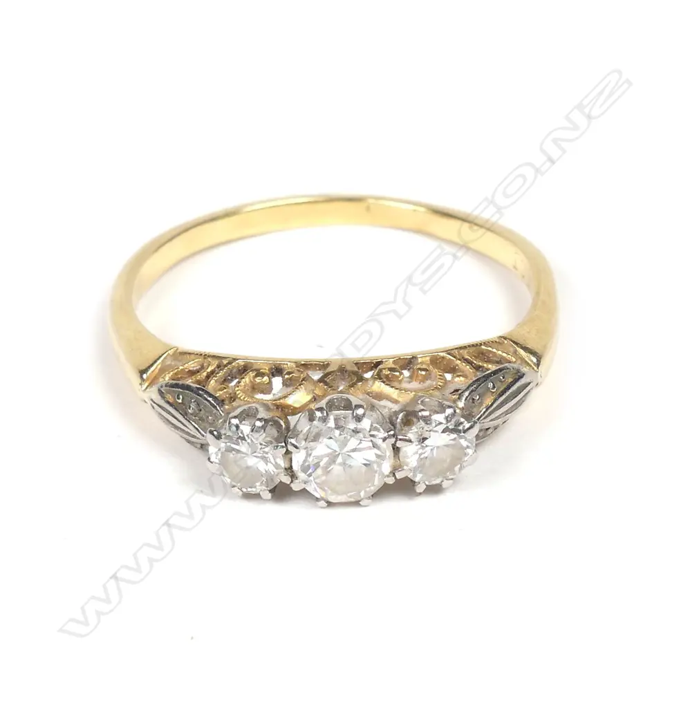 A c.1940s 18ct. yellow gold and three stone diamond ring Image 1++