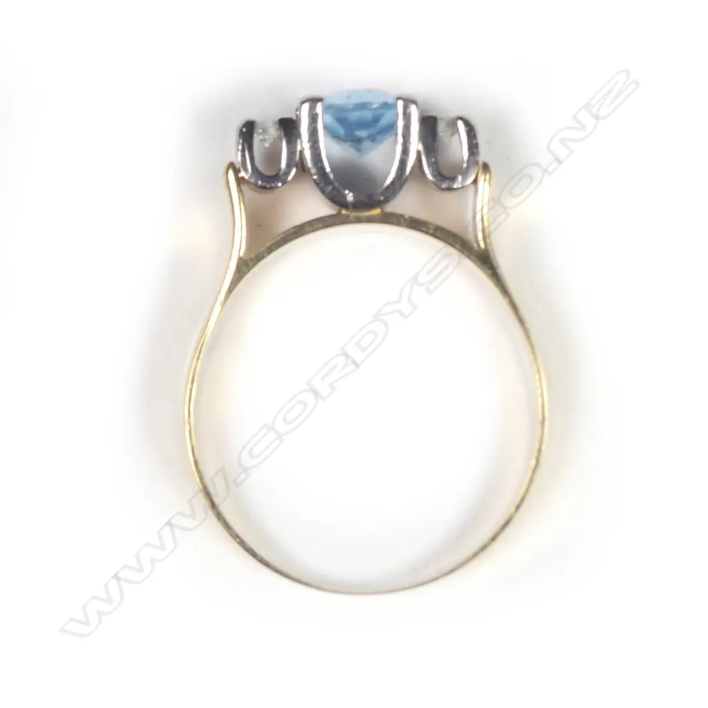 An 18ct gold aquamarine and diamond ring Image 1++
