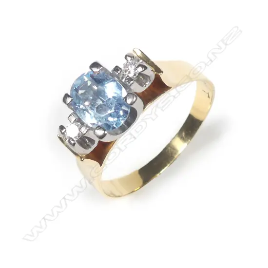 An 18ct gold aquamarine and diamond ring