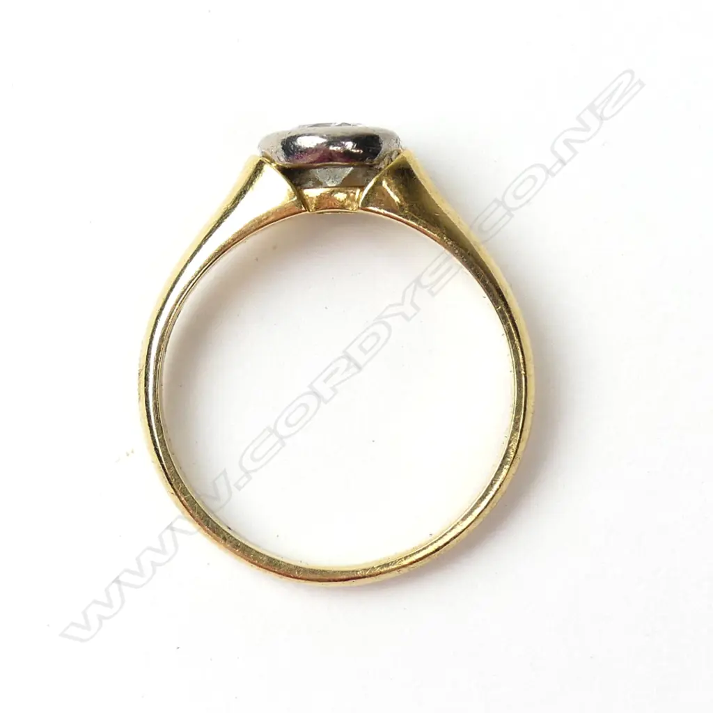 An 18ct yellow and white gold solitaire diamond ring Image 1++