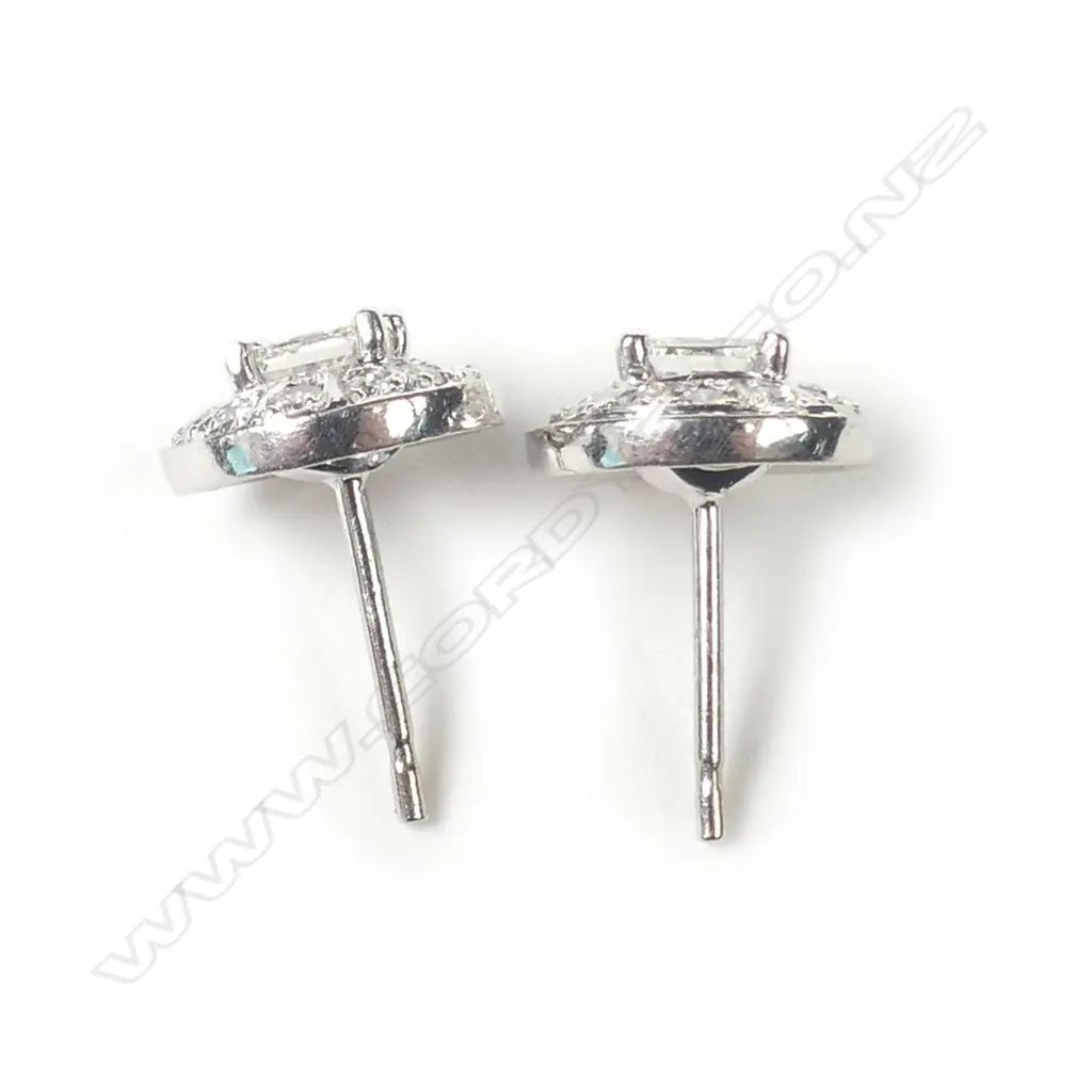 A pair of 9ct white gold and diamond earrings Image 1++