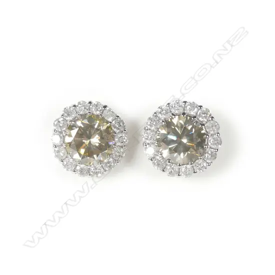 A pair of 14ct white gold diamond halo stud earrings