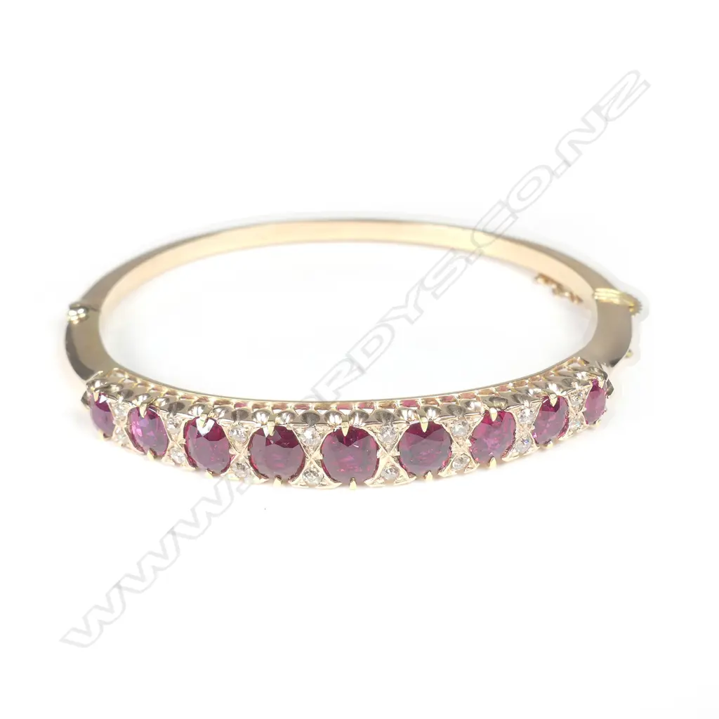An Edwardian 15ct gold ruby and diamond hinged bangle Image 1++